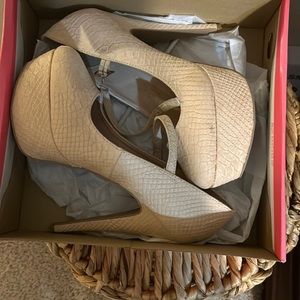 Size 8 platform high heels snake Biege in color by Charlotte Russe